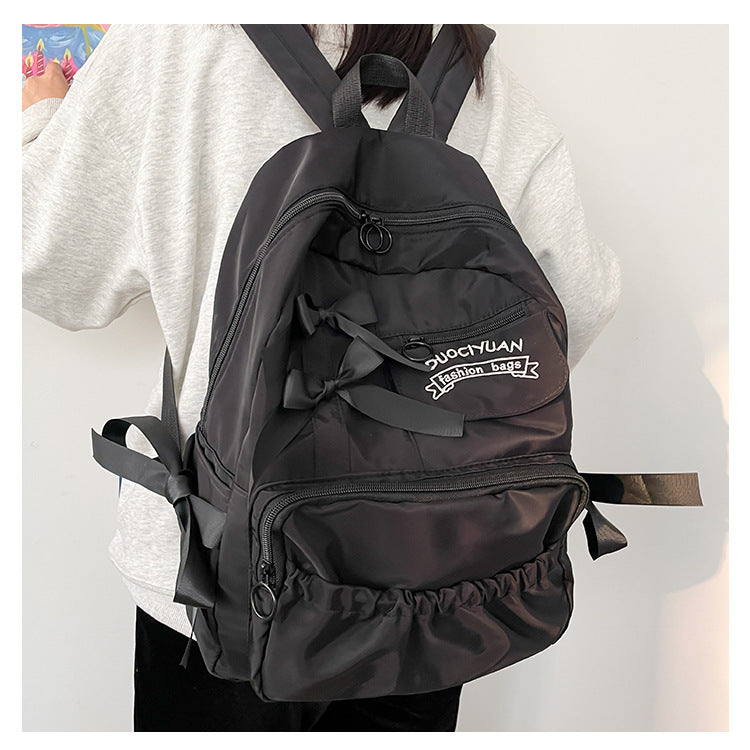 Women's Black Bow Accent Nylon Backpack Large Capacity School Travel Daypack